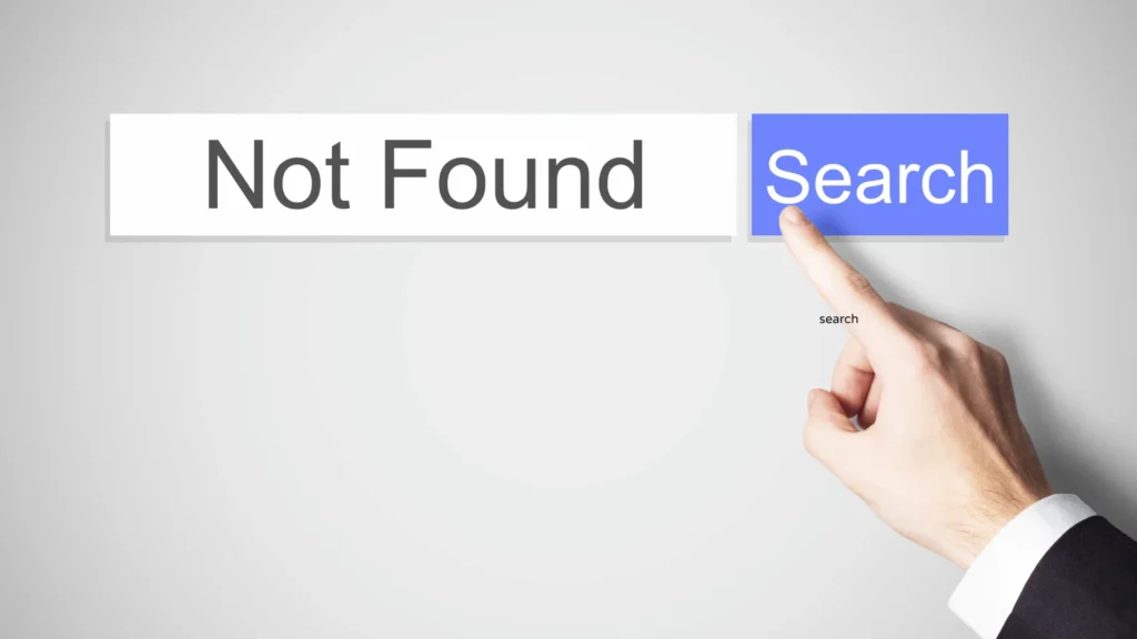 A hand in a suit pointing a finger to click a blue "Search" button next to a search bar displaying the text "Not Found".